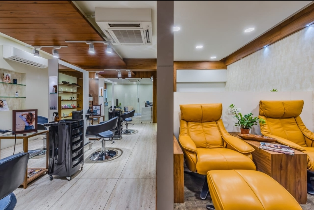 Lounge area with leather recliners and styling stations